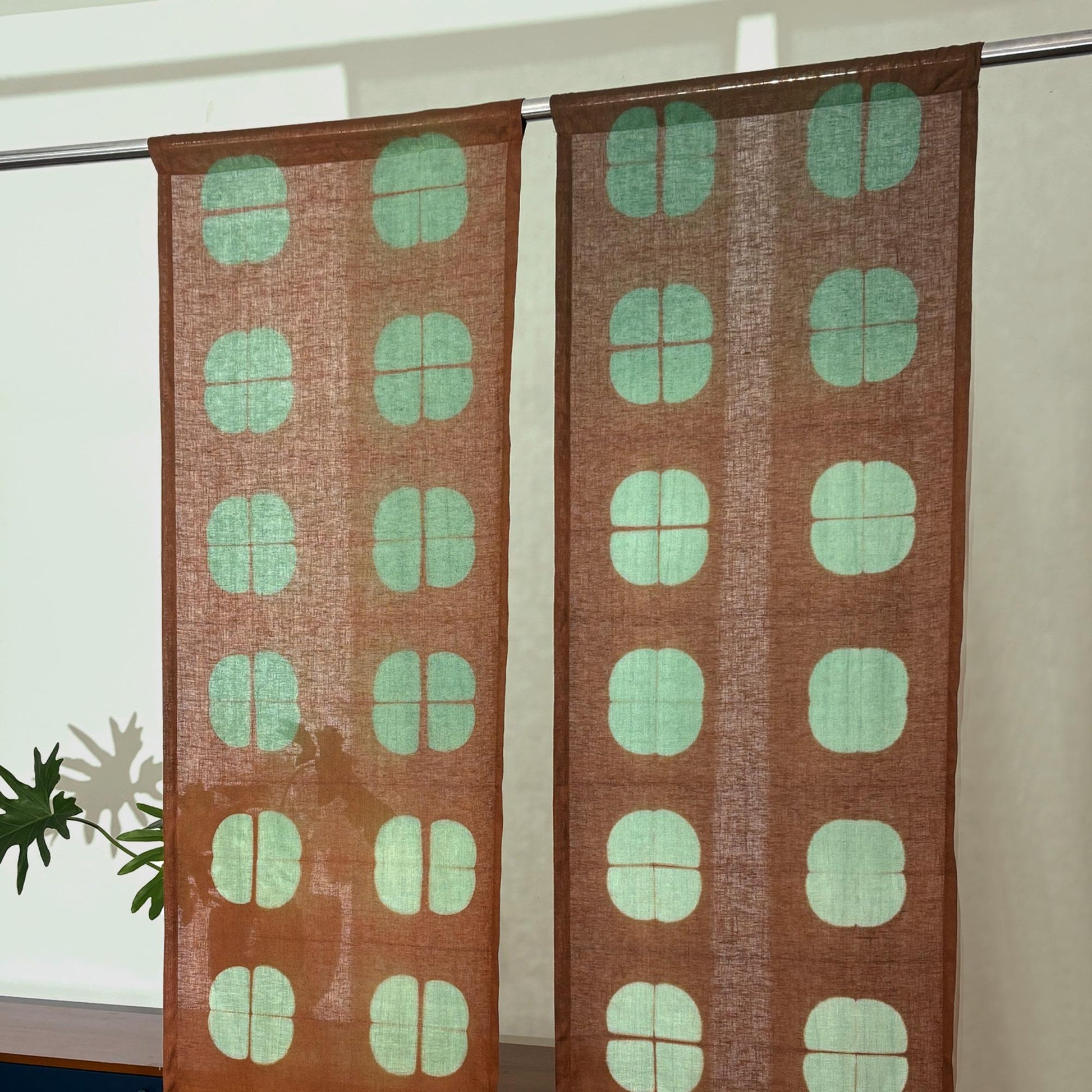 close-up of Motif Linen Noren — Amber Grid showing the natural resist-dye motif on linen