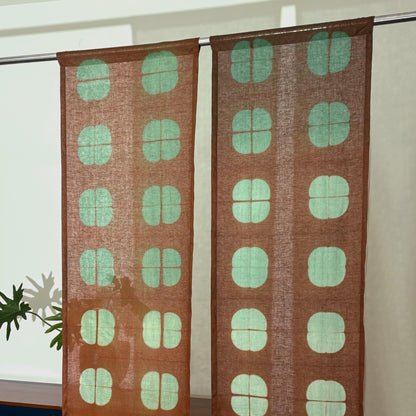 close-up of Motif Linen Noren — Amber Grid showing the natural resist-dye motif on linen