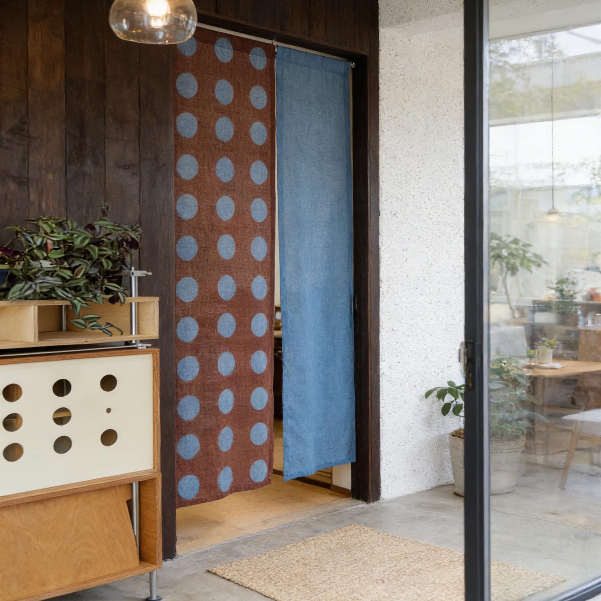 styled room scene with Polka Dot Linen Noren — Rust / Blue used as a window or doorway curtain