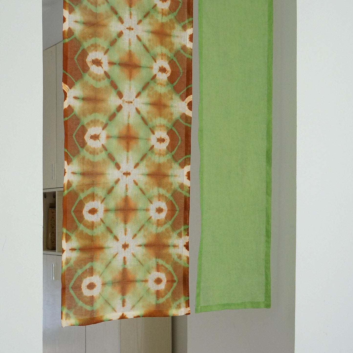 detail view of Motif Linen Noren — Green Bloom showing plant-dyed linen texture and pattern