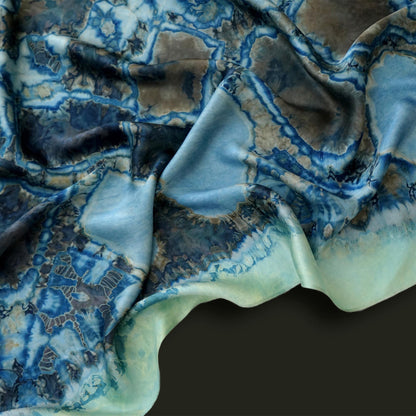 flat-lay view of Scarf — Deep Teal highlighting the natural dye and motif