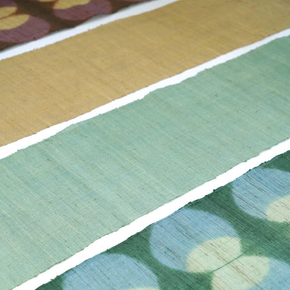 Narrow Ramie — Bean Motif displayed vertically on a wall as a decorative textile banner