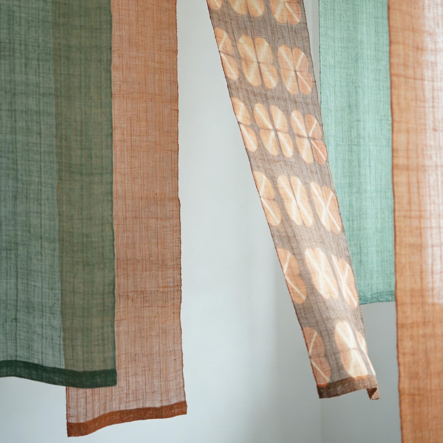 room scene featuring Ramie Ombre — Ochre Green hung by a window or doorway