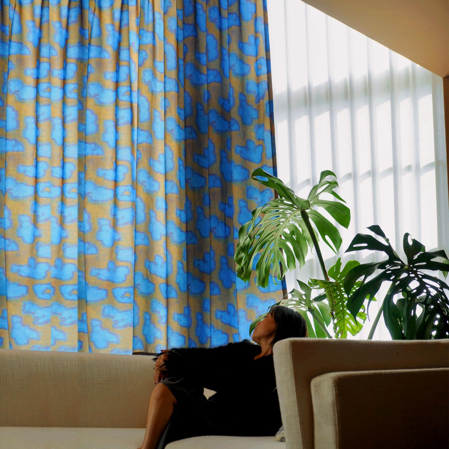 lifestyle scene with Pattern Drapery — Deep Blue creating a soft, airy room partition
