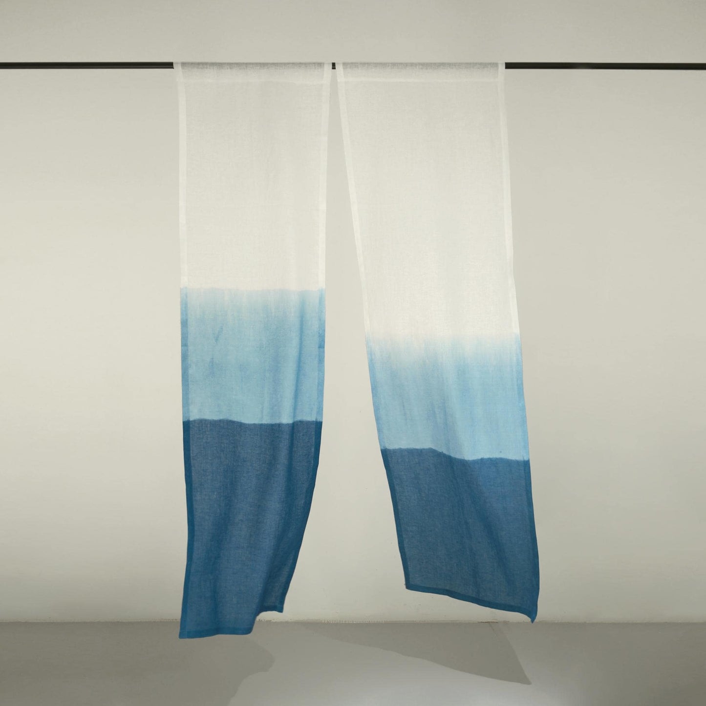detail view of Soft Tone Noren — Mist Blue showing plant-dyed linen texture and pattern