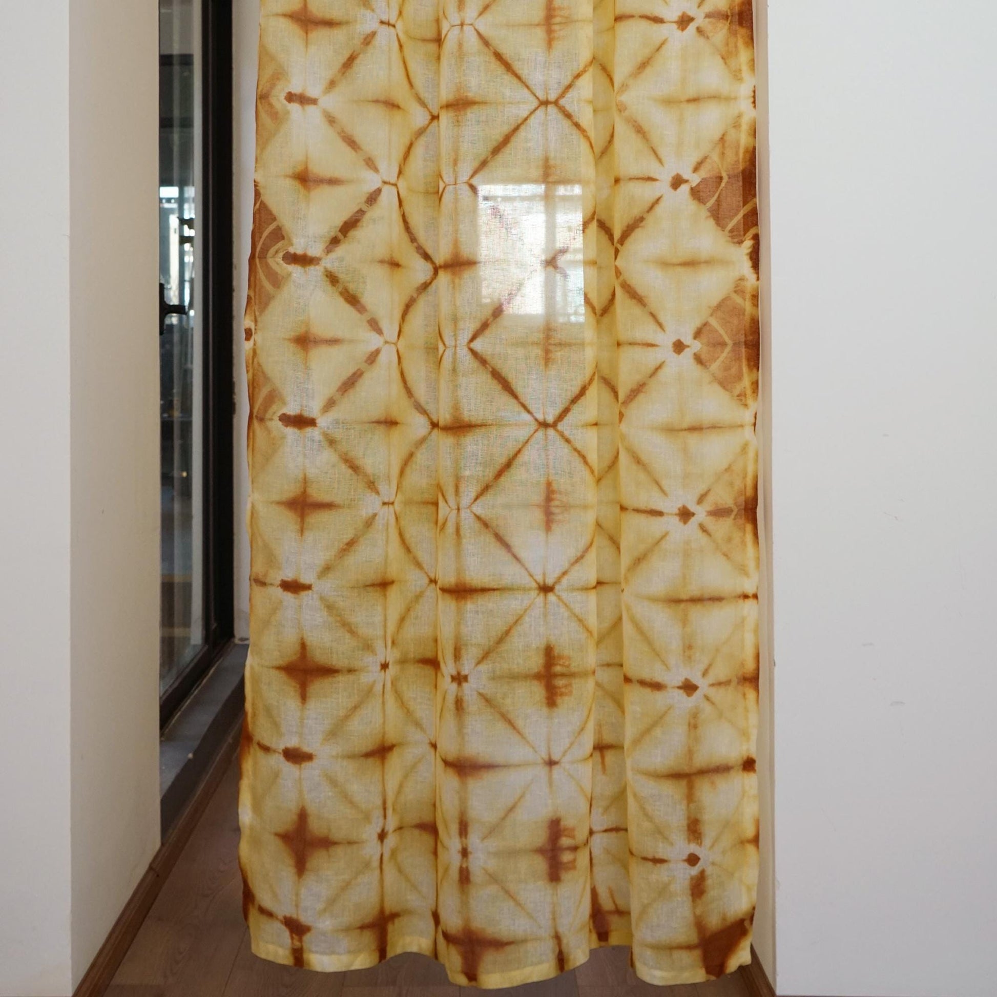 Linen Panel — Oat Dots hanging by a window, filtering daylight in a styled interior