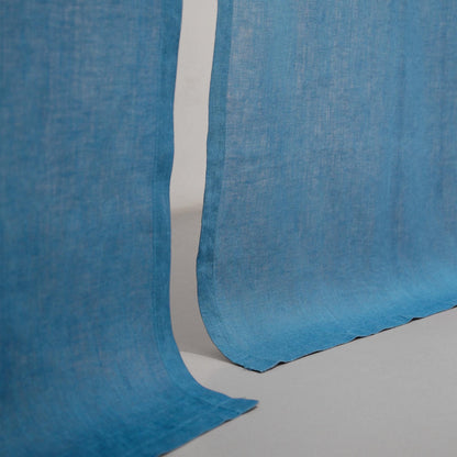 close-up of Soft Tone Noren — Mist Blue showing the natural resist-dye motif on linen