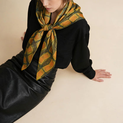 close-up of Scarf — Amber Green showing the soft weave and botanical color