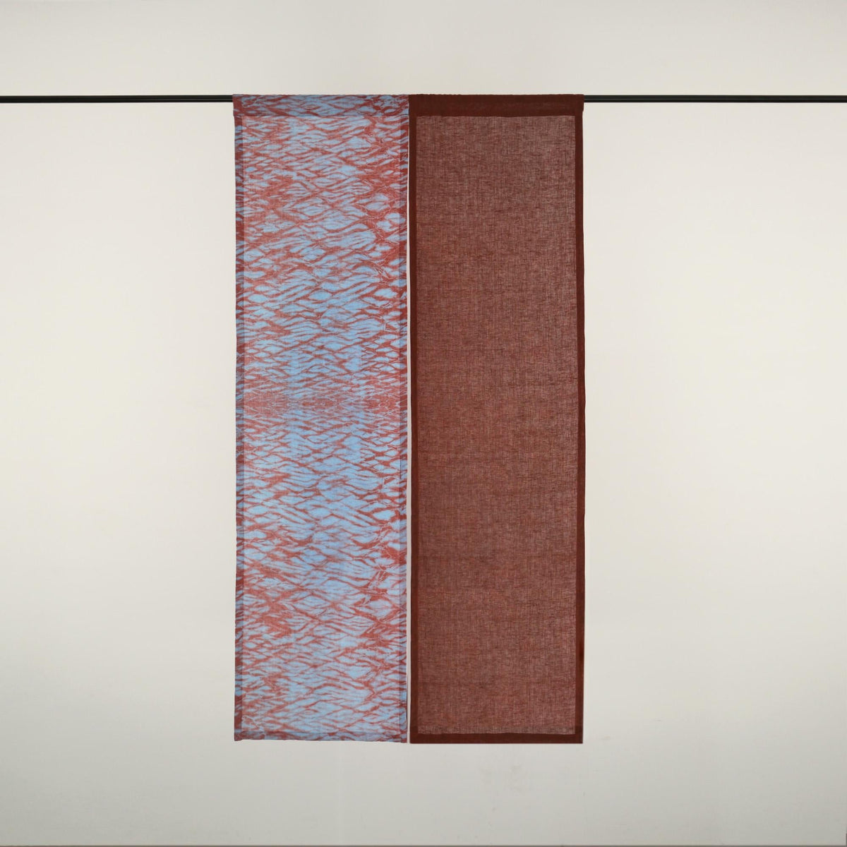 Plant-dyed linen noren 'Mist Red' — handmade Japanese doorway curtain with botanical motif.