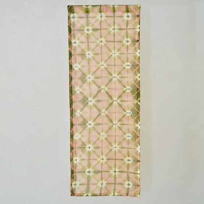 close-up of Motif Linen Noren — Peach showing the natural resist-dye motif on linen