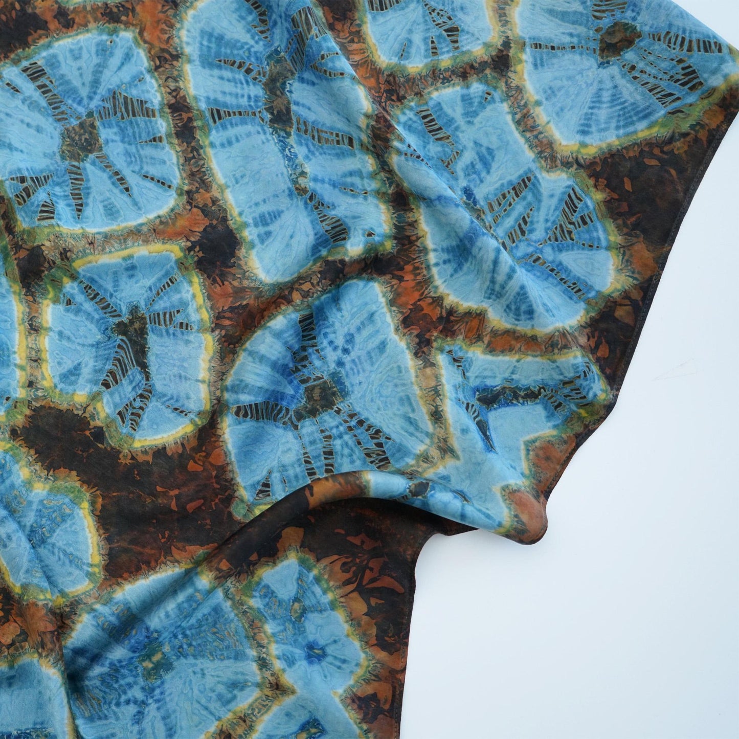 flat-lay view of Scarf — Aqua Bloom highlighting the natural dye and motif