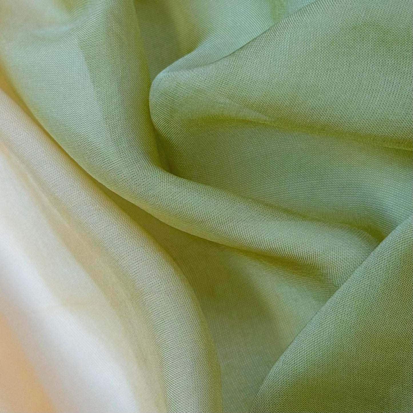 Sheer Curtain — Orange Green hung as window curtains in a bright room