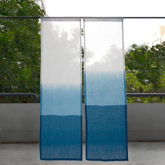 alternate angle of Soft Tone Noren — Mist Blue hanging as a two-panel doorway curtain