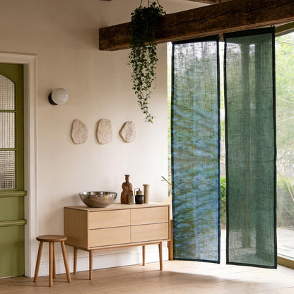 alternate angle of Motif Linen Noren — Wave hanging as a two-panel doorway curtain