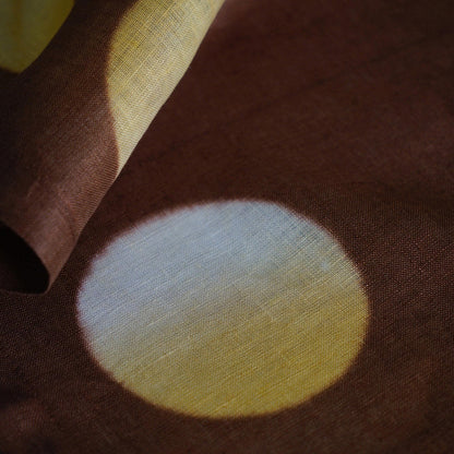 alternate angle of Polka Dot Linen Noren — Orange / Yellow hanging as a two-panel doorway curtain