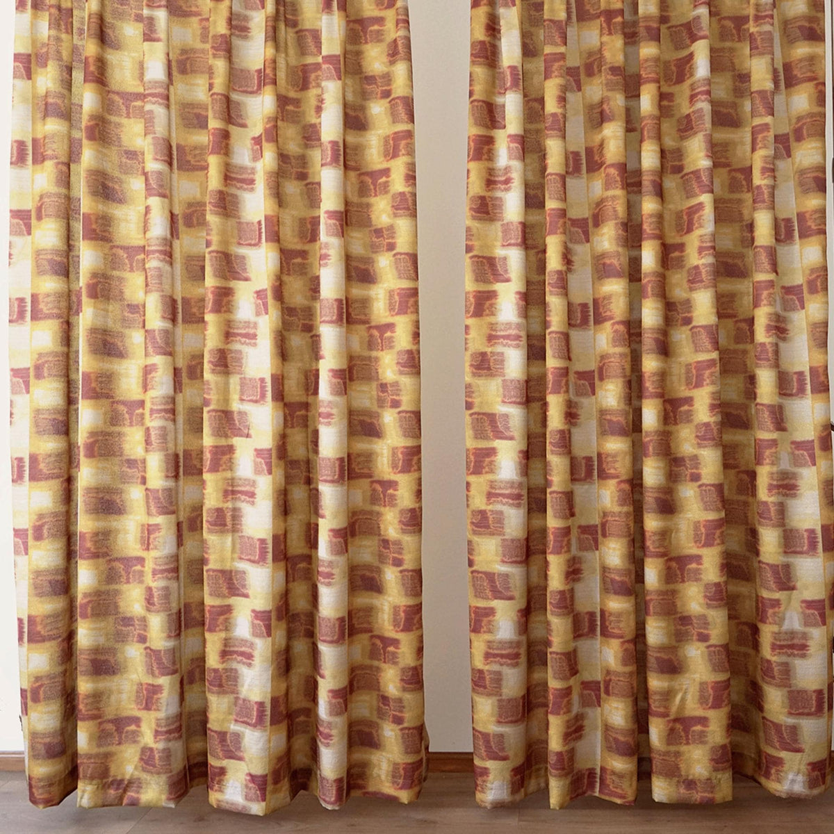 detail view of Pattern Drapery — Golden Ochre showing plant-dyed pattern and sheer drape