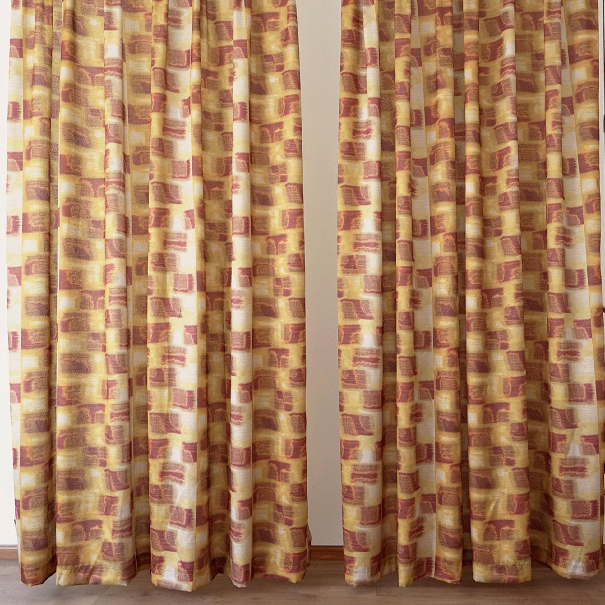 detail view of Pattern Drapery — Golden Ochre showing plant-dyed pattern and sheer drape
