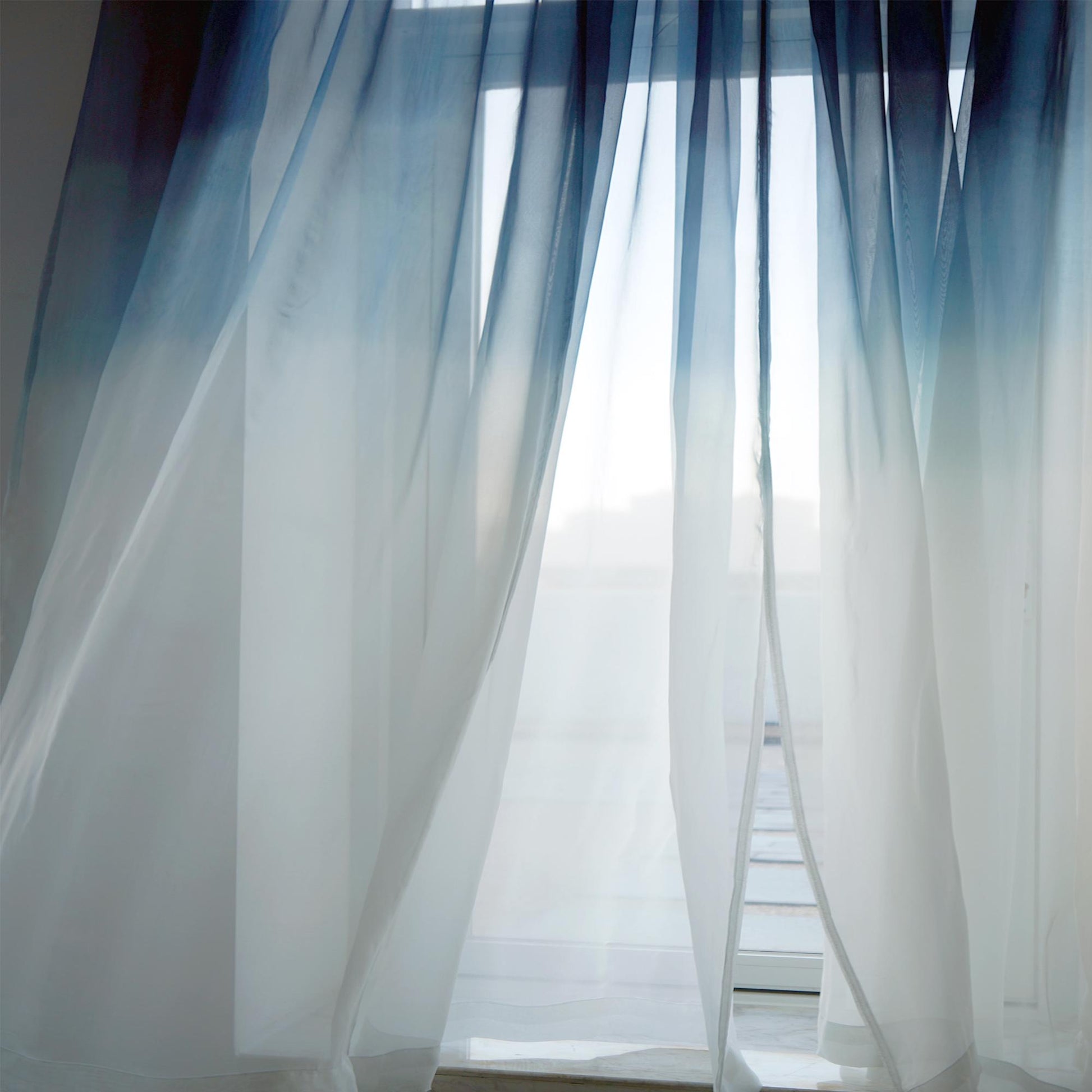 Sheer Curtain — Indigo Flow hung as window curtains in a bright room