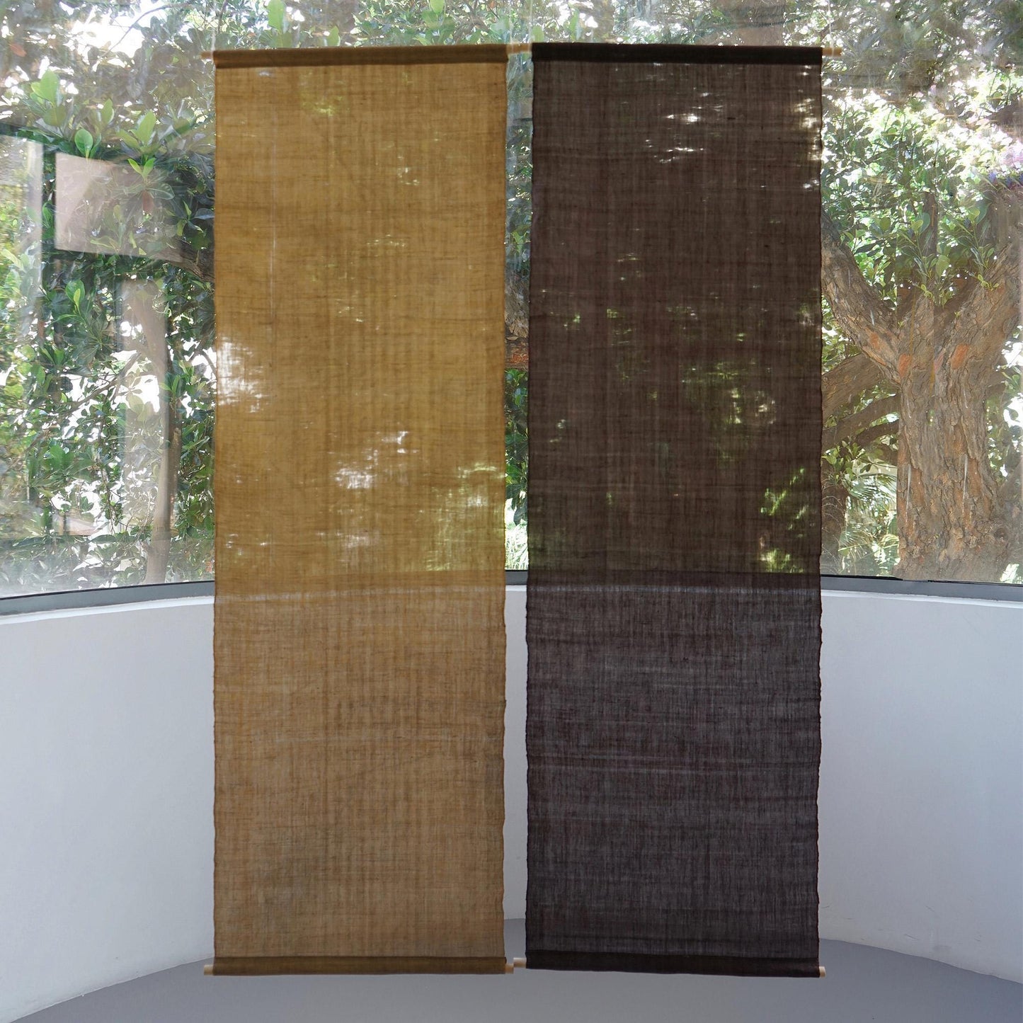 room scene featuring Ramie Ombre — Plum Grey hung by a window or doorway