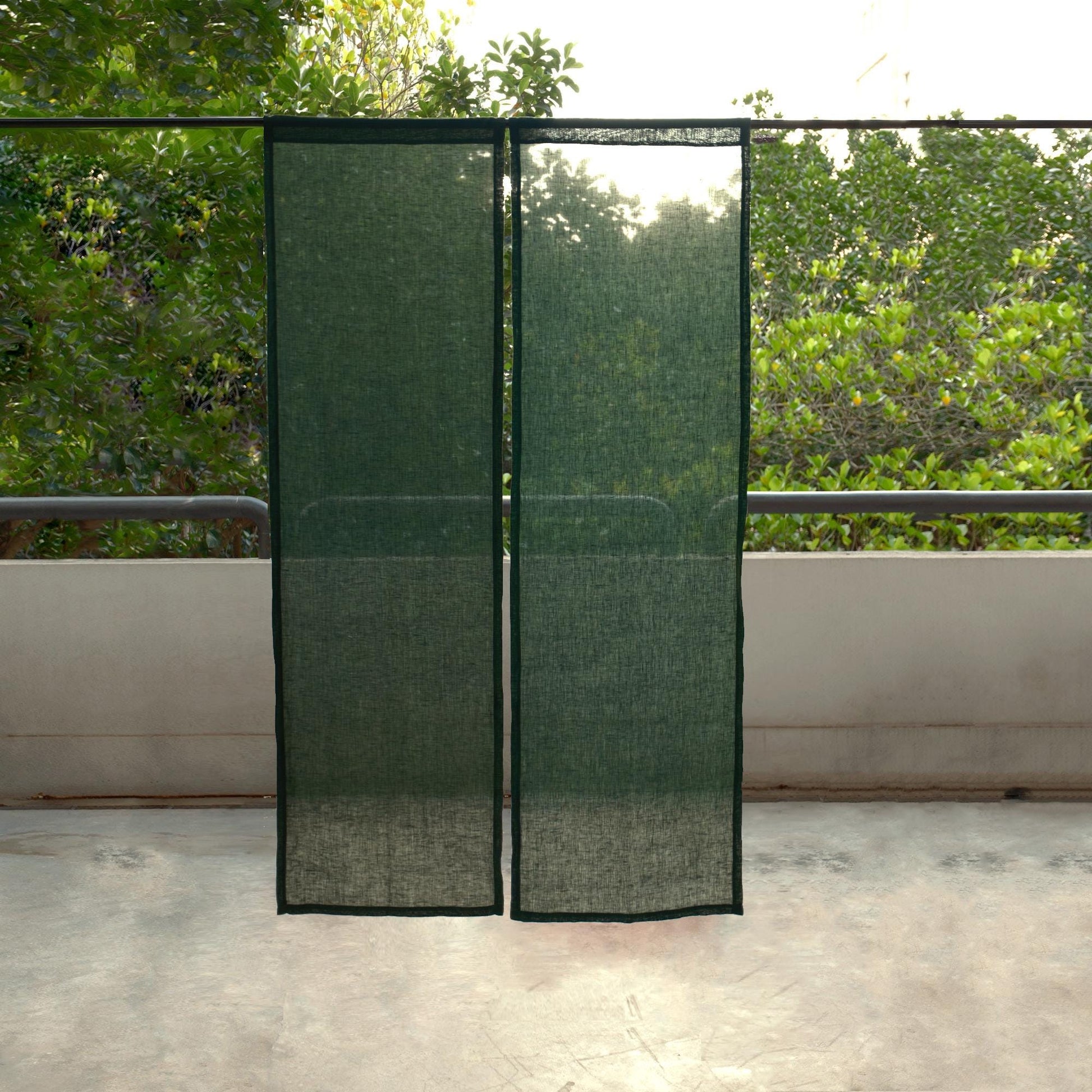 alternate angle of Soft Tone Noren — Sage Green hanging as a two-panel doorway curtain