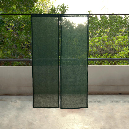 alternate angle of Soft Tone Noren — Sage Green hanging as a two-panel doorway curtain