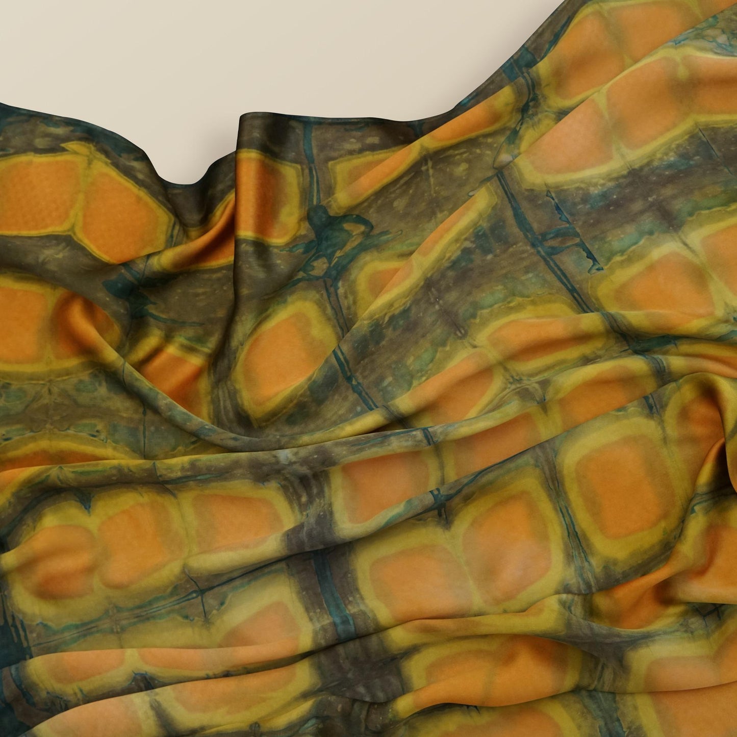 flat-lay view of Scarf — Amber Green highlighting the natural dye and motif