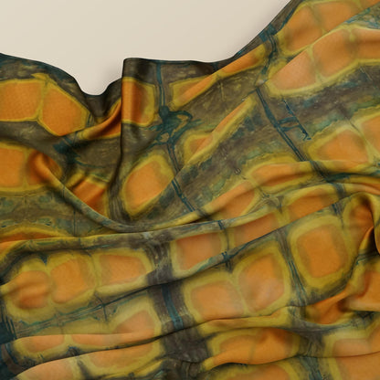 flat-lay view of Scarf — Amber Green highlighting the natural dye and motif