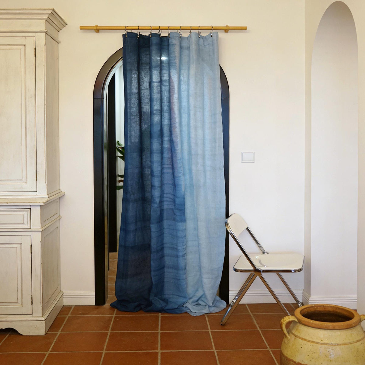 room scene with Linen Panel — Soft Blue used as sheer curtains in a living space