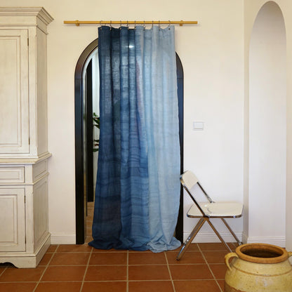 room scene with Linen Panel — Soft Blue used as sheer curtains in a living space