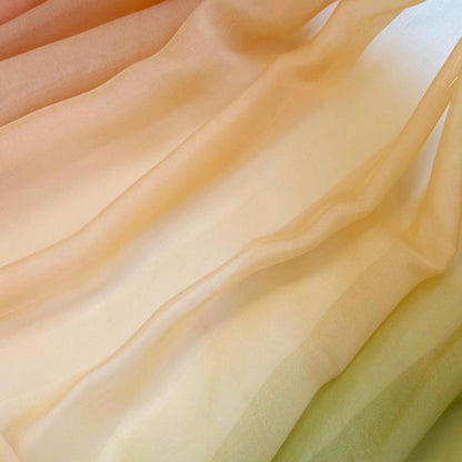 Sheer Curtain — Orange Green shown in a bedroom or living room setting