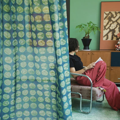 Pattern Drapery — Green Ochre shown in a bedroom interior with soft natural light