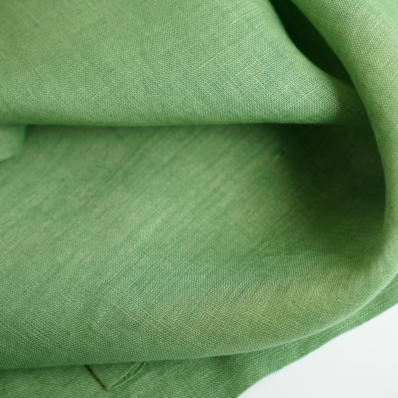 alternate angle of Polka Dot Linen Noren — Sage / Green hanging as a two-panel doorway curtain