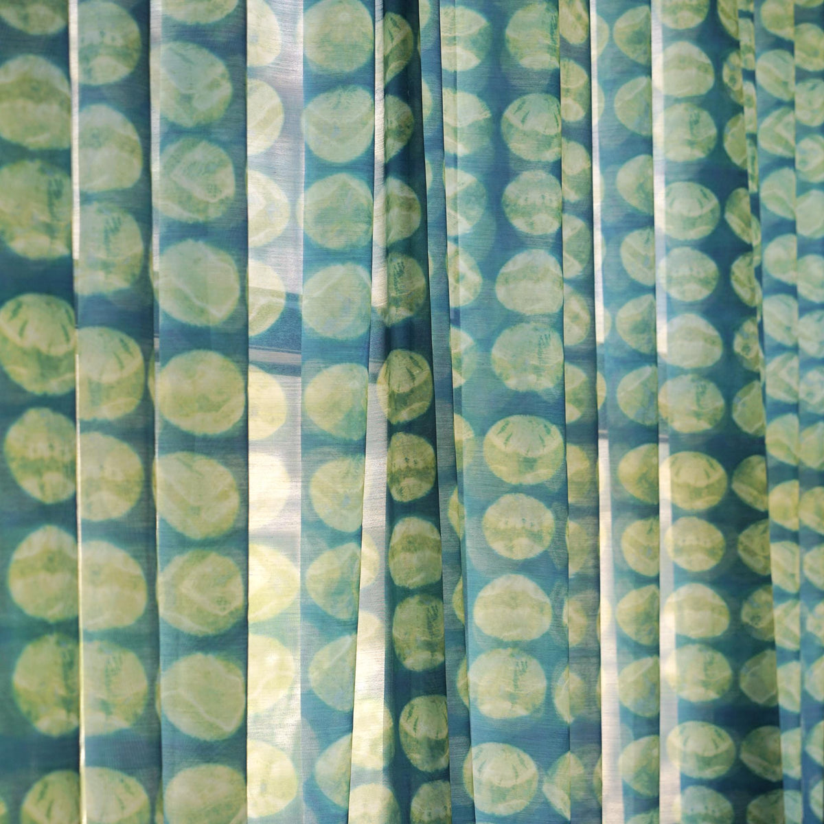 Pattern Drapery — Green Ochre dressing tall windows in a styled living room