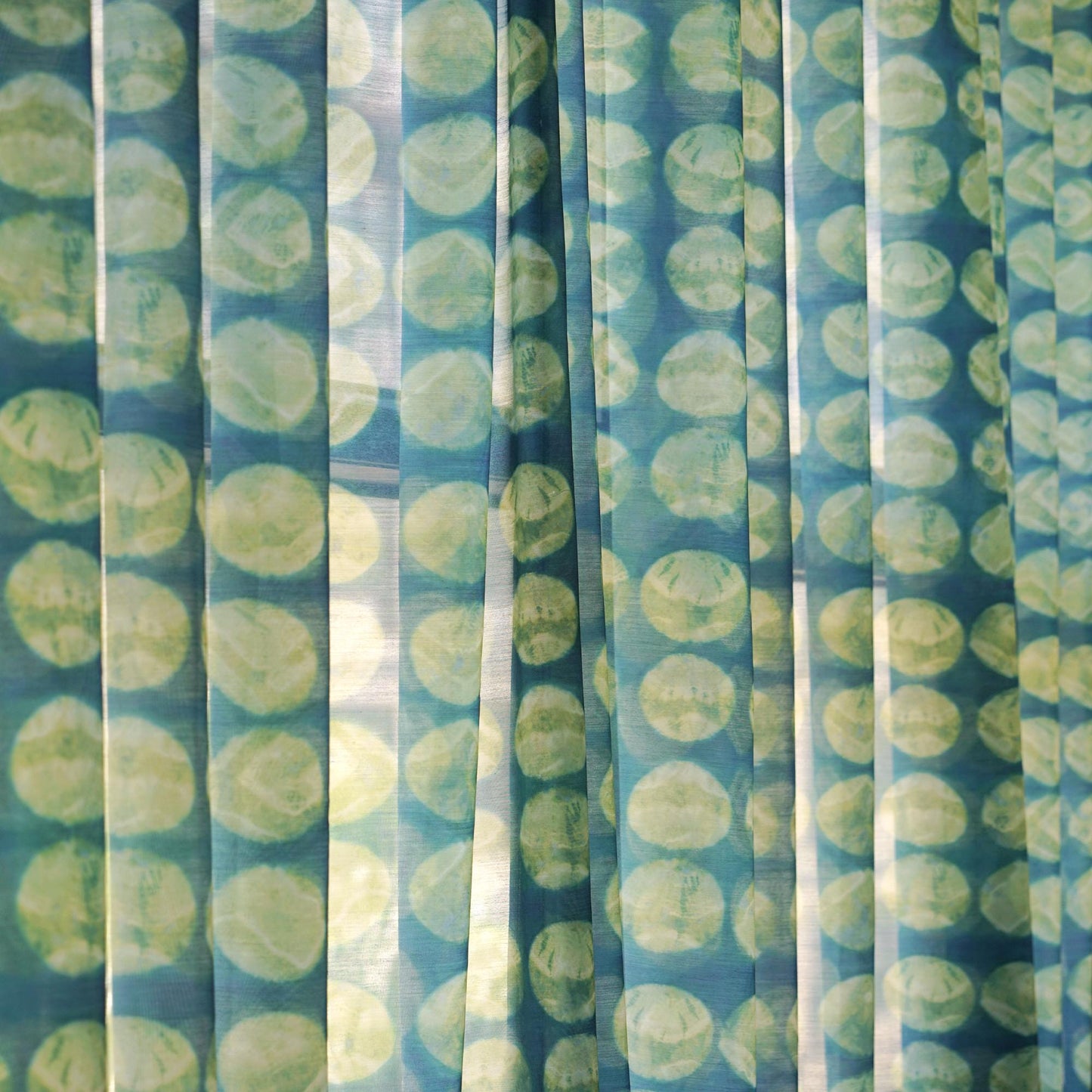 Pattern Drapery — Green Ochre dressing tall windows in a styled living room