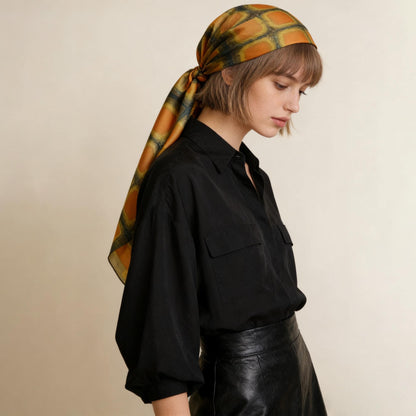 flat-lay view of Scarf — Amber Green highlighting the natural dye and motif