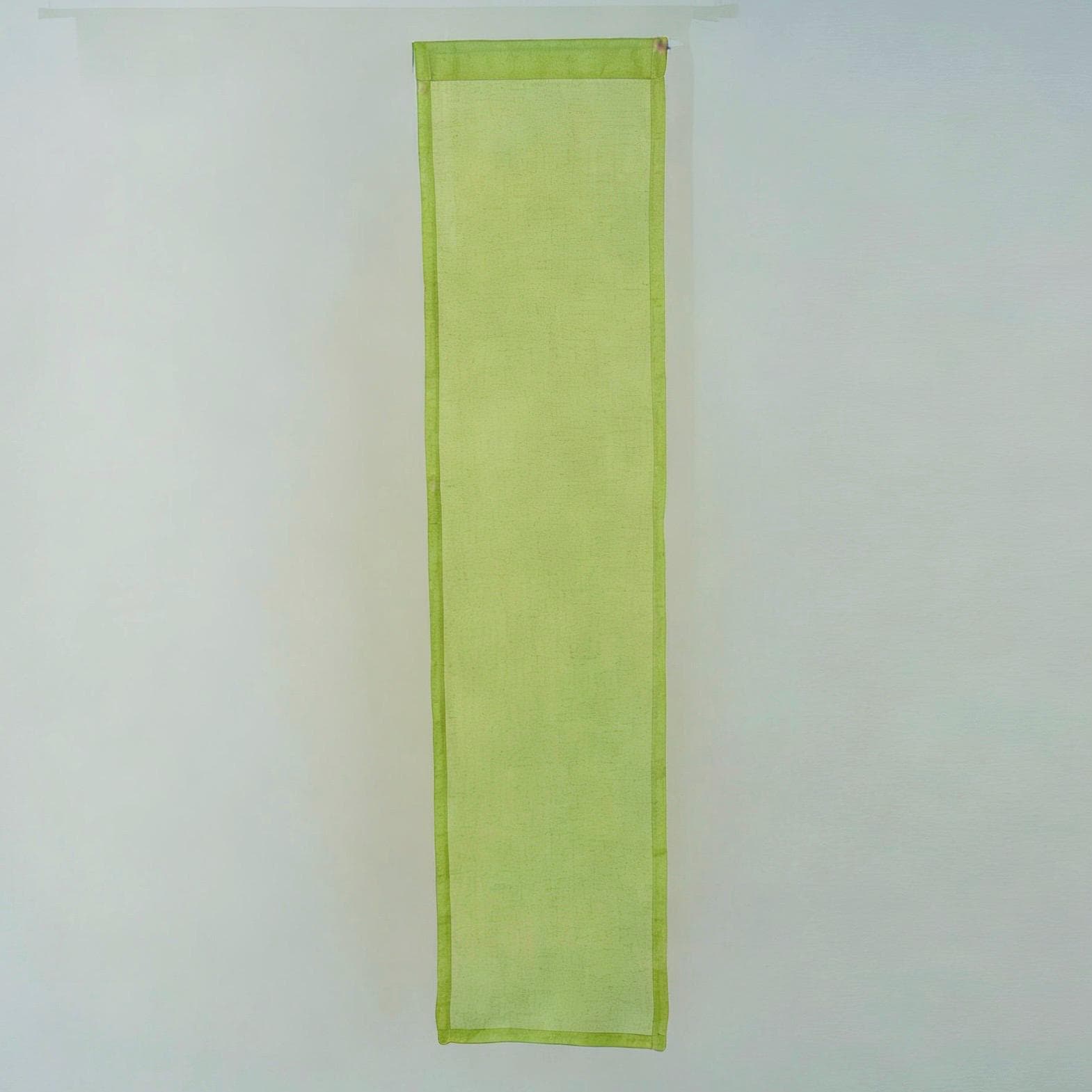 alternate angle of Motif Linen Noren — Peach hanging as a two-panel doorway curtain