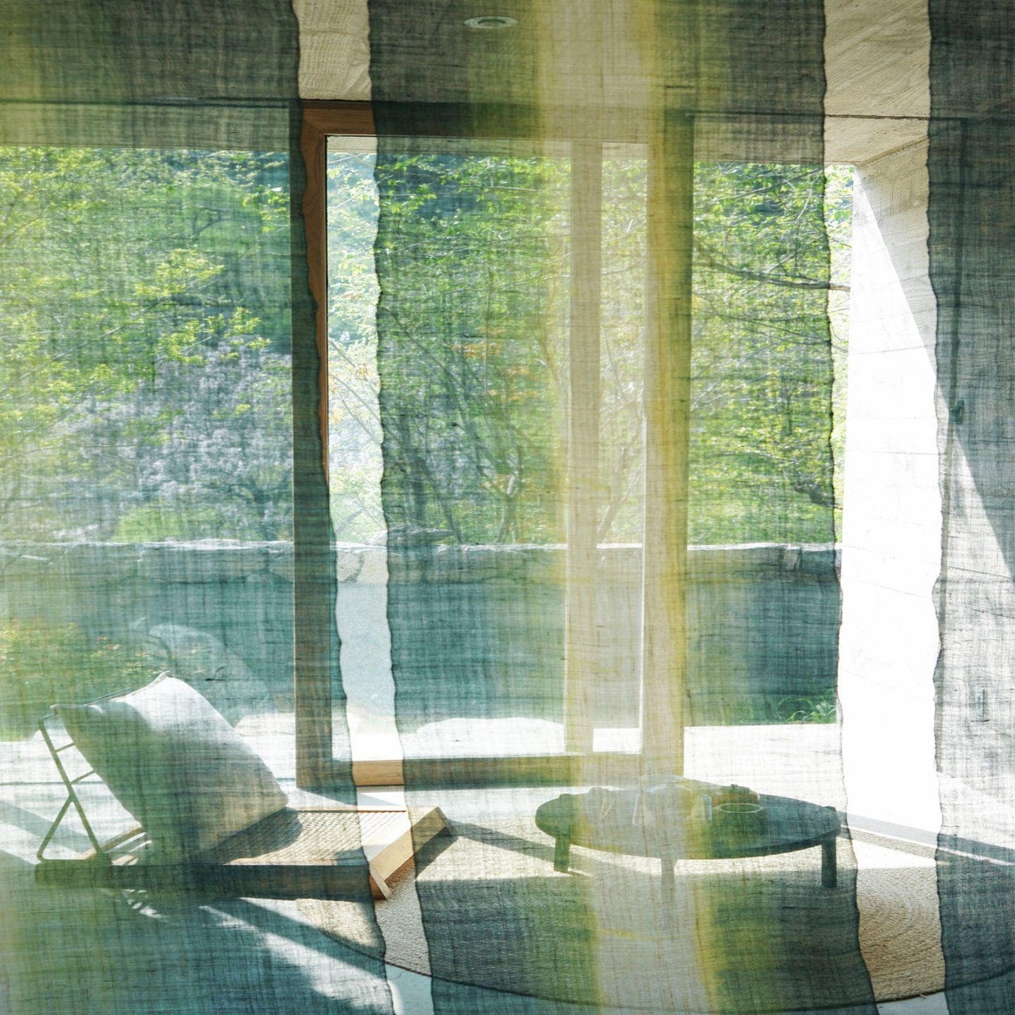 room scene featuring Ramie Ombre — Aqua Fade hung by a window or doorway