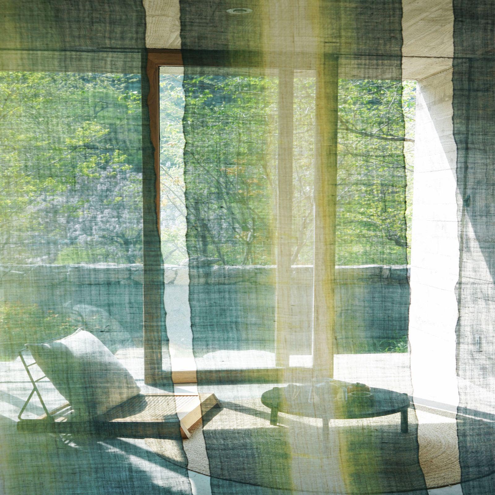 room scene featuring Ramie Ombre — Aqua Fade hung by a window or doorway