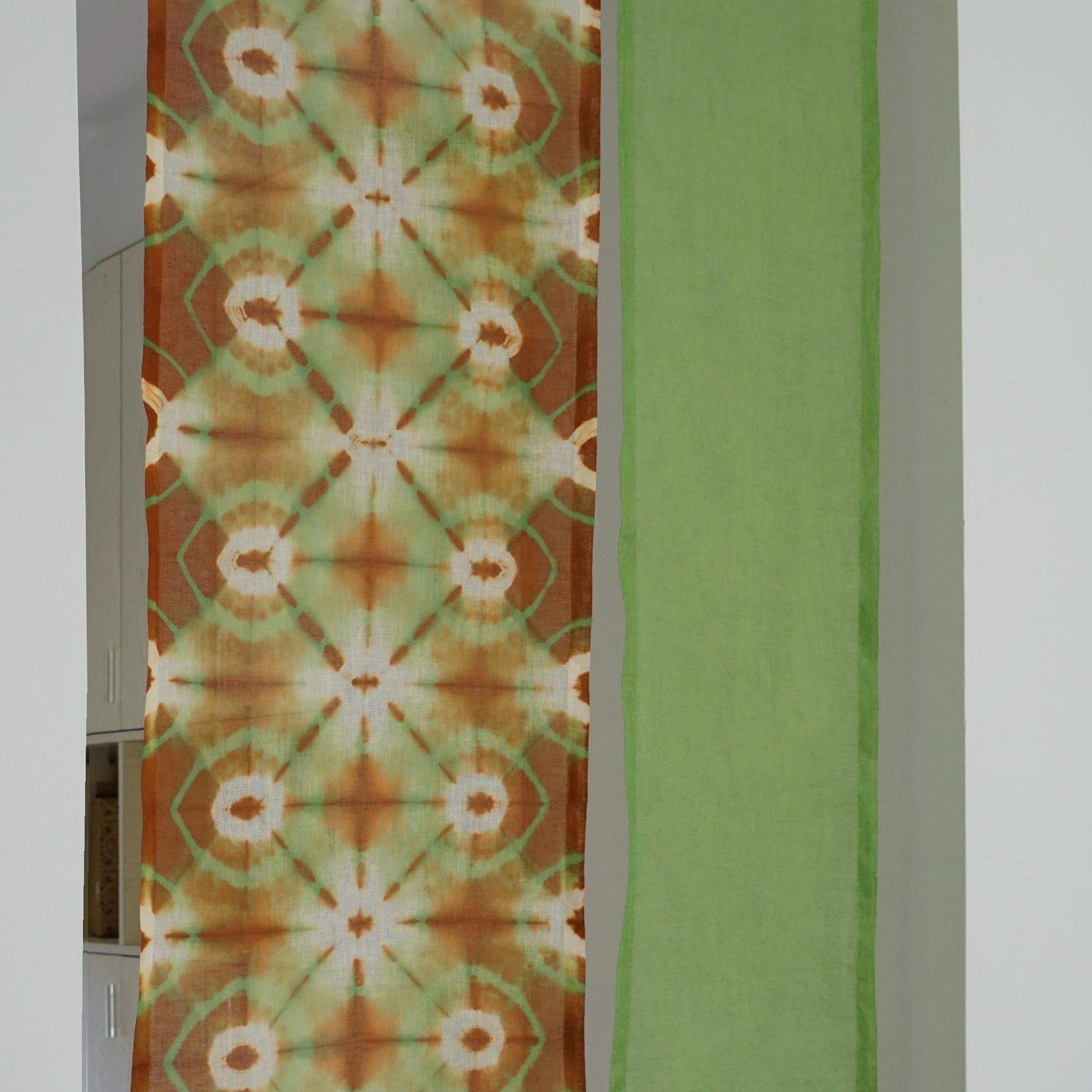 close-up of Motif Linen Noren — Green Bloom showing the natural resist-dye motif on linen
