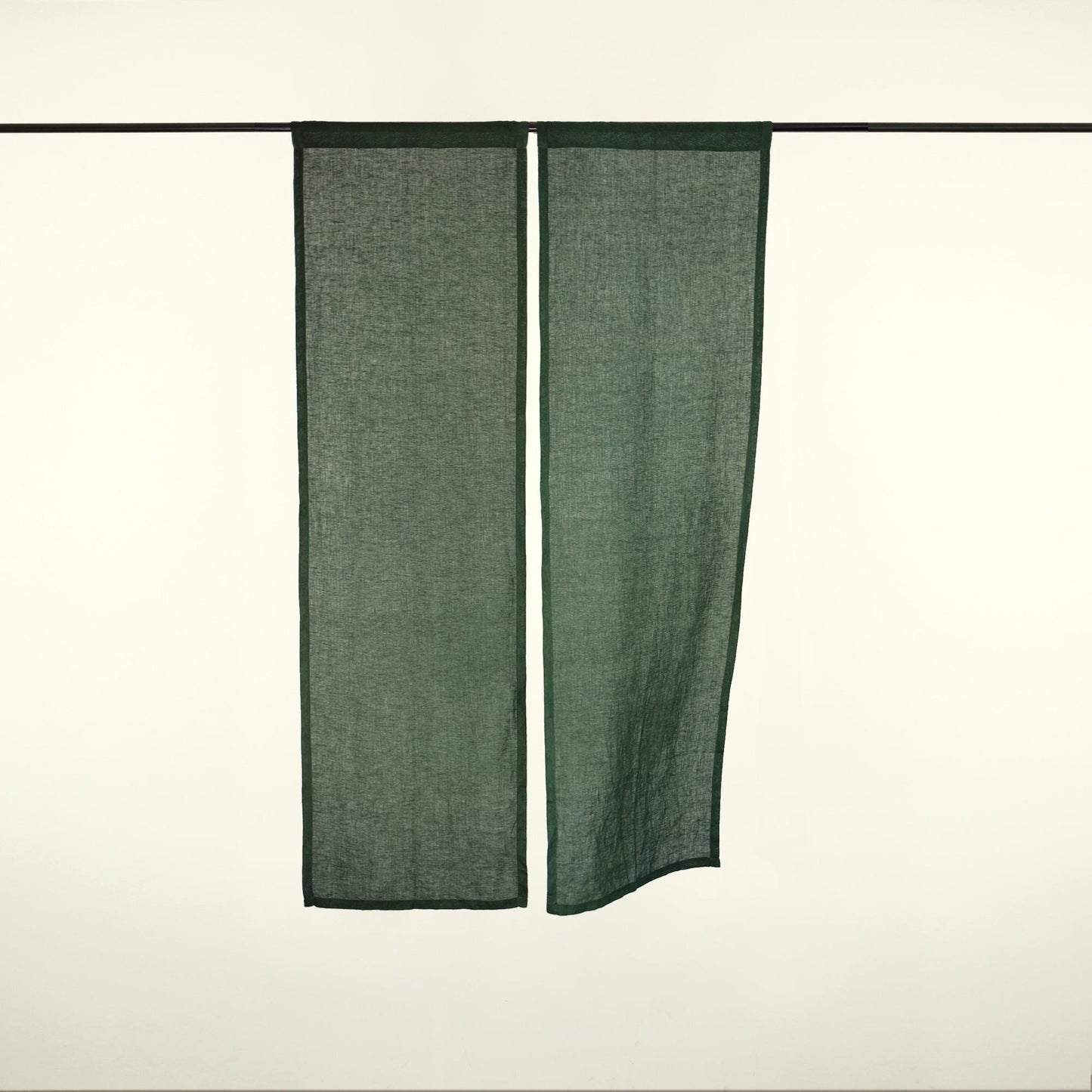 Minimalist Japanese noren 'Sage Green' — soft handmade plant-dyed linen doorway curtain.