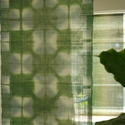 Ramie Cloth — Moss Light displayed as a room divider or wall hanging