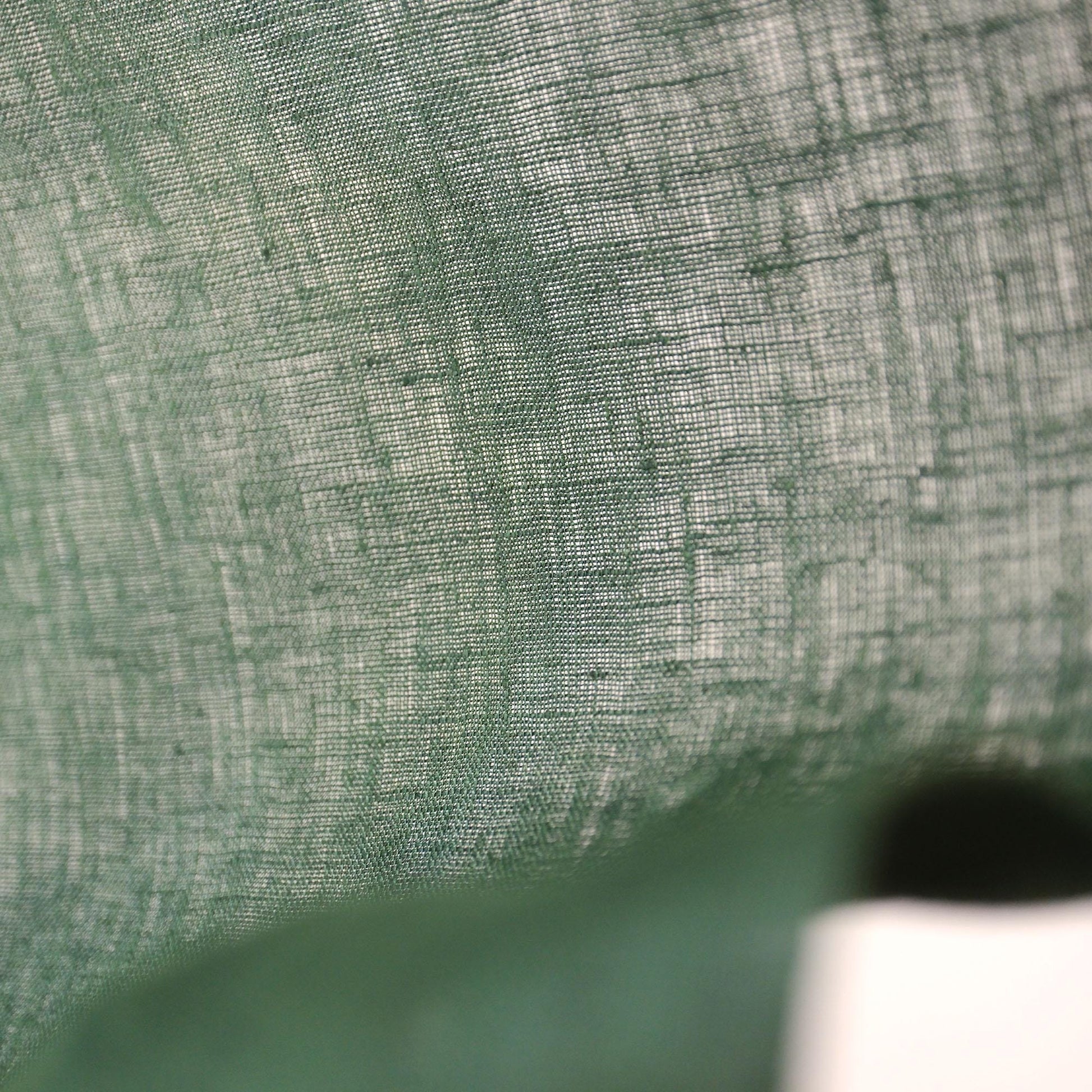 detail view of Soft Tone Noren — Sage Green showing plant-dyed linen texture and pattern