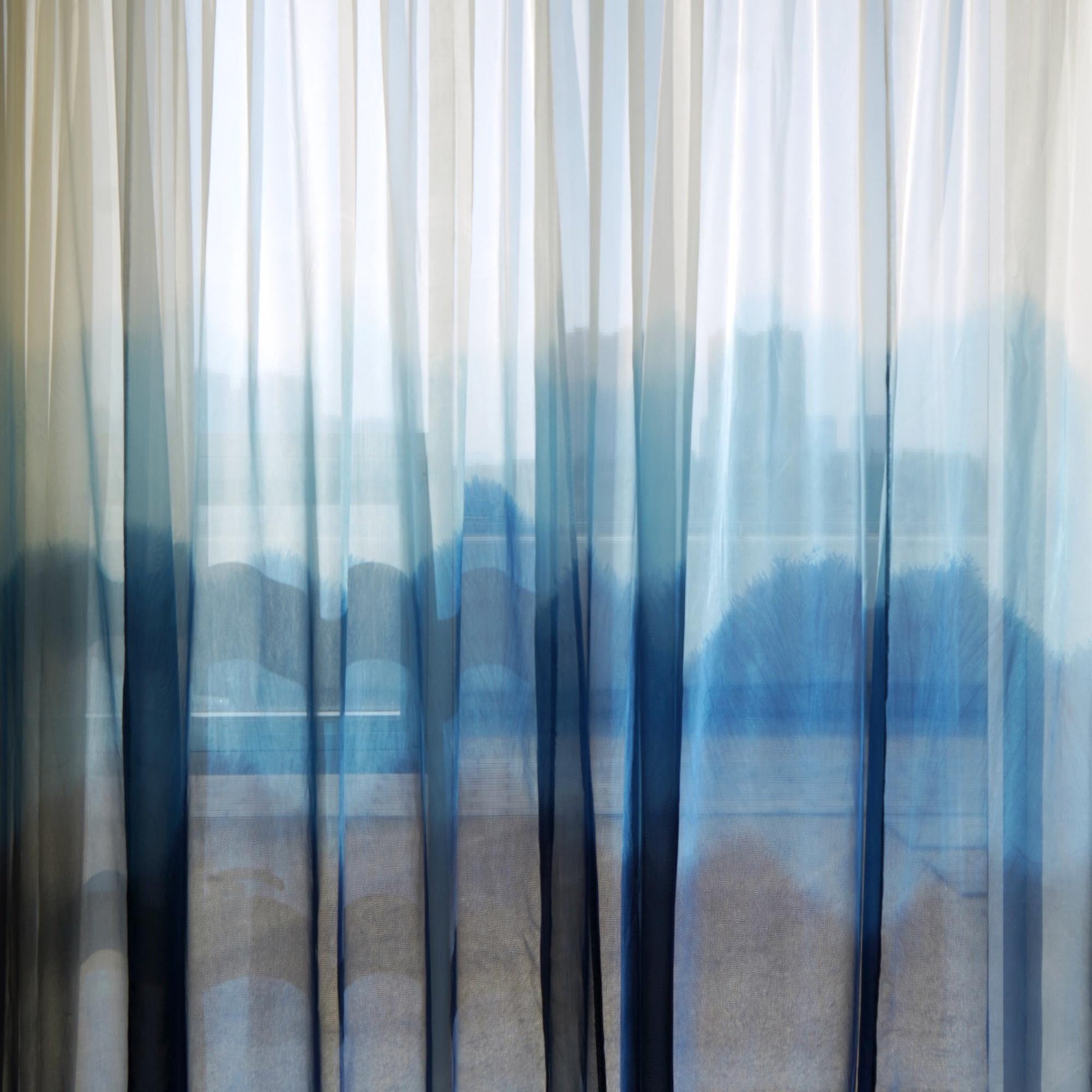 Sheer Curtain — White Blue shown in a bedroom or living room setting