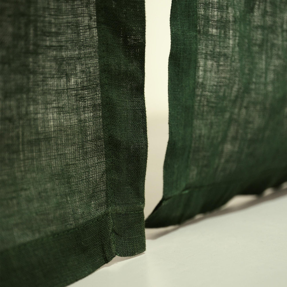 close-up of Soft Tone Noren — Sage Green showing the natural resist-dye motif on linen