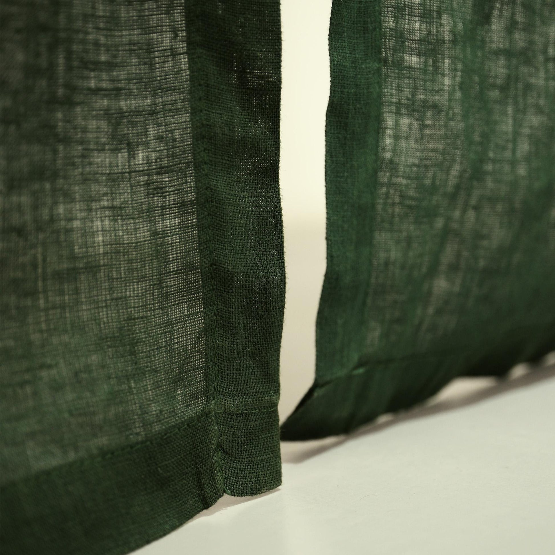 close-up of Soft Tone Noren — Sage Green showing the natural resist-dye motif on linen