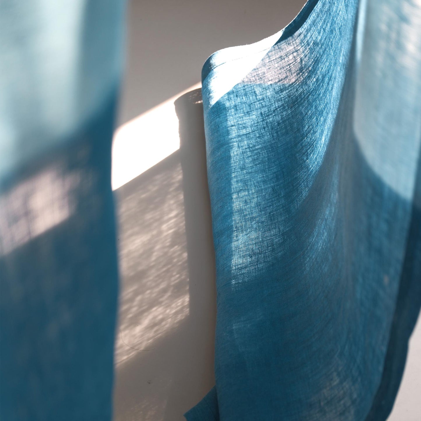 styled room scene with Soft Tone Noren — Mist Blue used as a window or doorway curtain