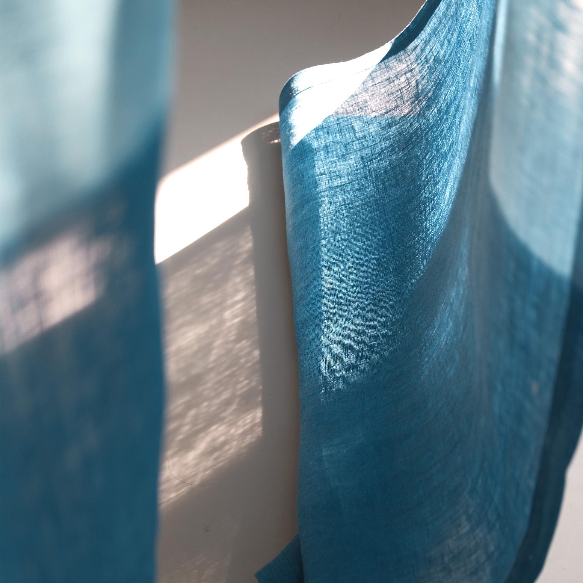 styled room scene with Soft Tone Noren — Mist Blue used as a window or doorway curtain