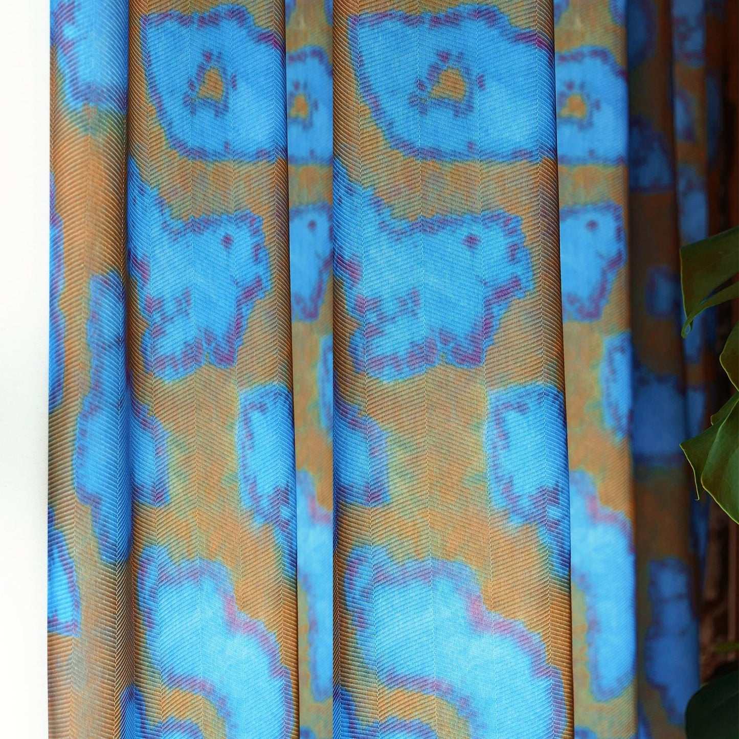 Pattern Drapery — Deep Blue dressing tall windows in a styled living room