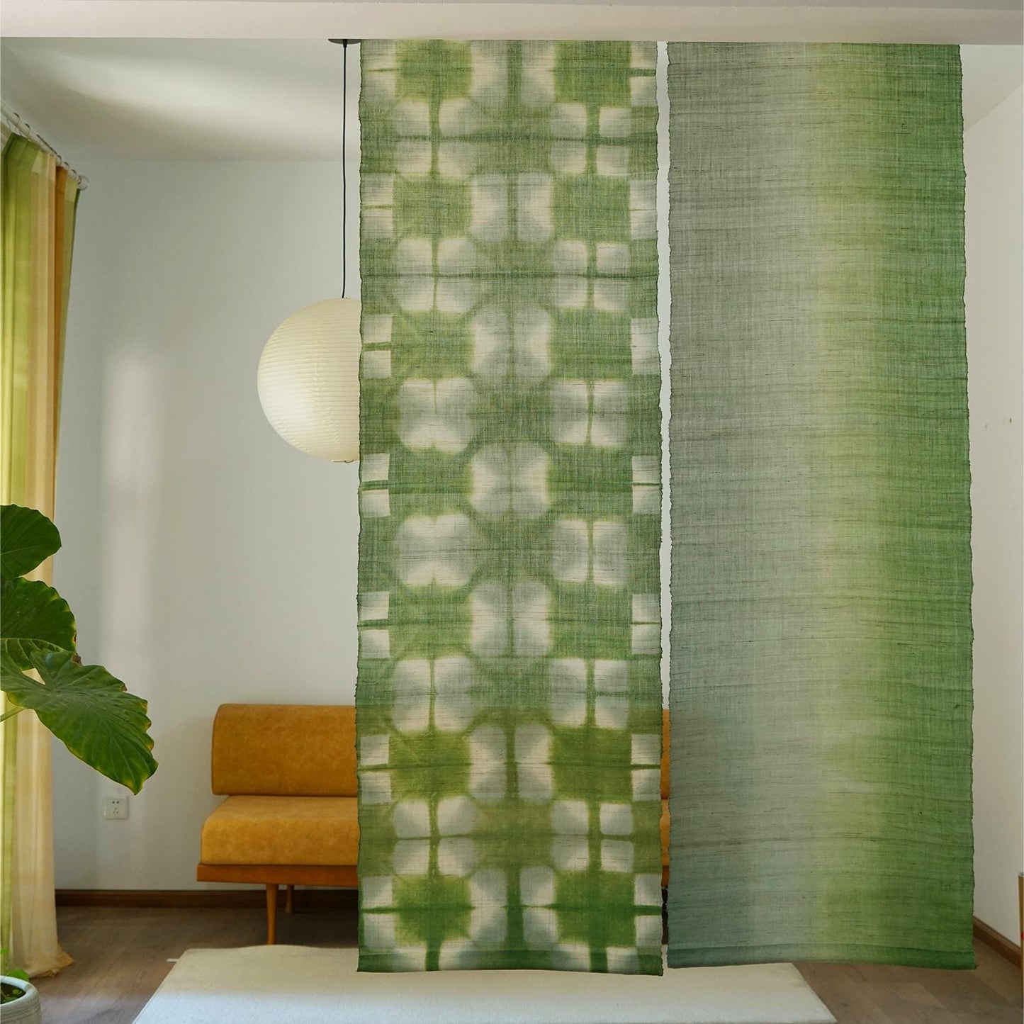 Ramie Cloth — Moss Light displayed as a room divider or wall hanging