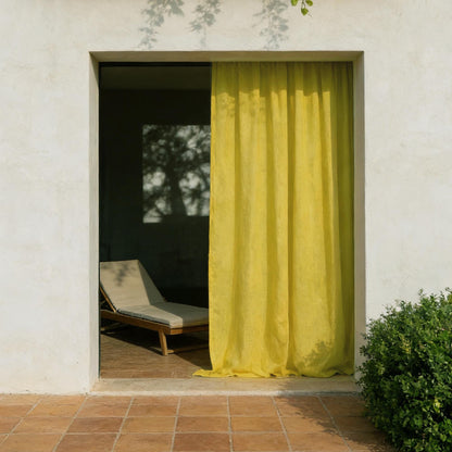 Linen Panel — Citron Yellow hanging by a window, filtering daylight in a styled interior
